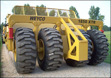 Four 23.5 x 25 tires for greater flotation and Quick-Detach rear push block. 